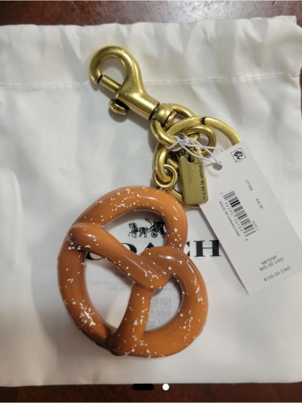 HOT!!!!  Coach Gold-Tone Pretzel Purse Charm in Brown.  NWT and Dusty